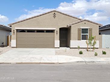 Charming single-story home with a two-car garage, desert landscaping, and a welcoming entrance at 37098 W Prado St, Maricopa, AZ 85138