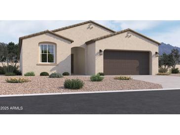 Charming single-story home featuring a two-car garage and low-maintenance desert landscaping at 24080 W Bowker St, Buckeye, AZ 85326