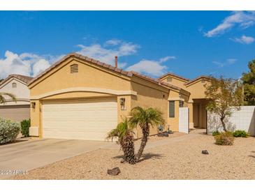 Charming single-story home with a two-car garage, desert landscaping and a well maintained front yard at 3252 E Fremont Rd, Phoenix, AZ 85042