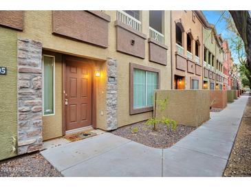 Apartment building exterior showcasing multiple units, varied textures, and a welcoming entrance at 1920 E Bell Rd # 1006, Phoenix, AZ 85022