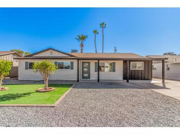 Charming single-story home featuring a landscaped front yard and a welcoming entrance at 3315 W Shaw Butte Dr, Phoenix, AZ 85029