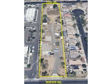 An aerial view showcases the property with its surrounding neighborhood, highlighting its street access at 502 E Roeser Rd, Phoenix, AZ 85040