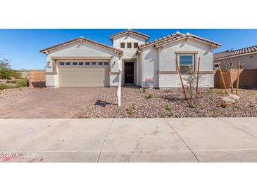 Charming single-Gathering home featuring a two-car garage and well-maintained desert landscaping at 12022 W Marguerite Ave, Avondale, AZ 85323