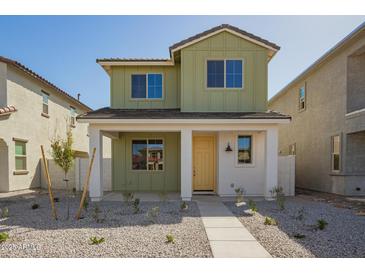 Charming two-story home featuring a welcoming front porch and low-maintenance landscaping at 15584 S 180Th Ln, Goodyear, AZ 85338