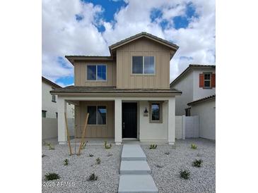 Charming two-story home with a covered porch and minimalist gravel landscaping at 15586 S 181St Dr, Goodyear, AZ 85338