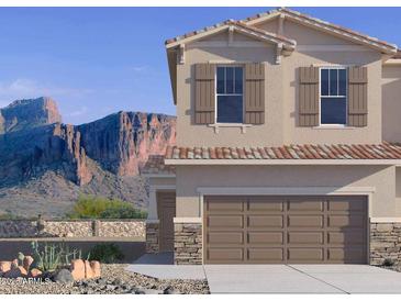 Inviting two-story home featuring a two car garage and beautiful desert landscaping at 21216 N 58Th St, Phoenix, AZ 85054