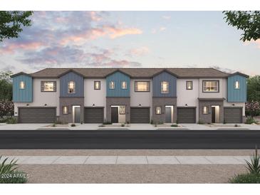 Charming townhome exteriors boast colorful accents and attached garages at 2843 W Eagle Talon Rd, Phoenix, AZ 85085