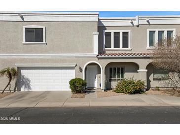 Charming two-story townhome with a well-maintained front yard and a convenient attached two-car garage at 5236 N 16Th Ln, Phoenix, AZ 85015