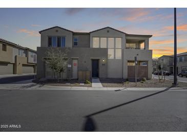 Modern two-story home featuring a balcony and neutral stucco exterior at 734 E Doral Ave # 202, Gilbert, AZ 85297