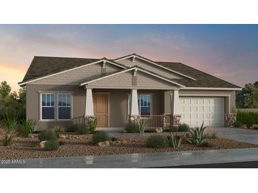 Charming single-story home with a stone-accented front porch and attached two-car garage at 19072 E Caledonia Dr, Queen Creek, AZ 85142