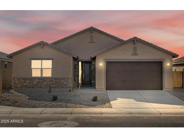 Charming single-story home featuring a well-maintained yard, two-car garage, and neutral color palette at 2639 E Santa Ynez Dr, Casa Grande, AZ 85194
