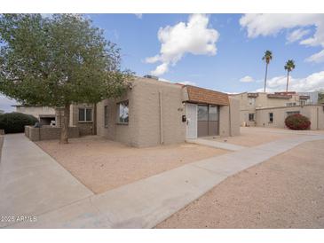 Charming single-story home featuring a desert landscape and private entrance at 4719 E Belleview St, Phoenix, AZ 85008