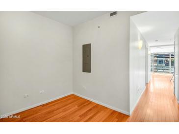 Bright bedroom with hardwood floors and a modern aesthetic at 7137 E Rancho Vista Dr # 6009, Scottsdale, AZ 85251