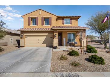 Charming two-story home with desert landscaping and a cozy front porch area at 18040 W Louise Dr, Surprise, AZ 85387