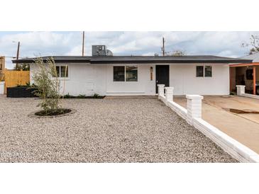 Charming single-story home with a well-maintained gravel yard and freshly painted white exterior at 2161 E Corona Ave, Phoenix, AZ 85040