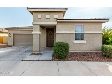 Charming single-Gathering home featuring a two-car garage and inviting front porch at 2753 S 85Th Way, Mesa, AZ 85209