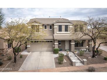 Beautiful two-story home with a well-manicured front yard and charming curb appeal at 35317 N 31St Dr, Phoenix, AZ 85086