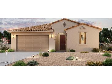 Inviting single-story home featuring a tile roof, an arched entryway and a two car garage, all set in a low maintenance desert landscape at 2296 S 246Th Ln, Buckeye, AZ 85326