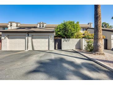 Charming townhouse featuring attached two-car garage, lovely trees, and convenient front access at 2338 W Lindner Ave # 22, Mesa, AZ 85202