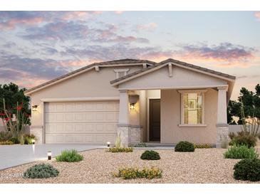 Charming single-story home with a two-car garage and well-maintained desert landscaping at 35295 W La Paz St, Maricopa, AZ 85138