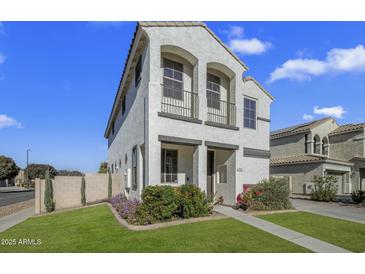 Charming two-story home with a well-maintained front lawn and decorative architectural details at 4132 E Santa Fe Ln, Gilbert, AZ 85297