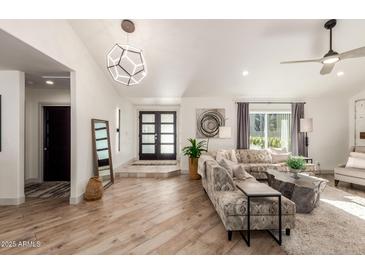 Bright living room featuring modern decor, stylish seating, and ample natural light at 9515 N 47Th St, Phoenix, AZ 85028