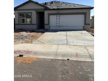 New construction home showing the front of the house with a concrete driveway leading to a two car garage at 3983 E San Jose St, San Tan Valley, AZ 85143