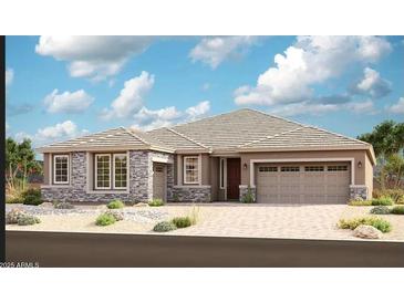 Charming single-story home featuring stone accents, a two-car garage, and desert landscaping for enhanced curb appeal at 20261 W Monterey Way, Buckeye, AZ 85396