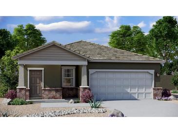 Charming single-story home featuring a two-car garage and covered entry at 15660 W Deanne Dr, Waddell, AZ 85355