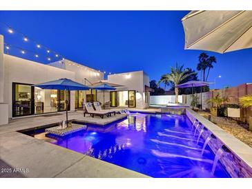 Beautiful outdoor pool and lounge area with modern white exterior at twilight at 31 E Bishop Dr, Tempe, AZ 85282