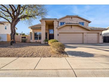 Inviting two-story home features a neutral color palette, well-maintained landscaping, and a spacious three-car garage at 4617 E Montgomery Rd, Cave Creek, AZ 85331