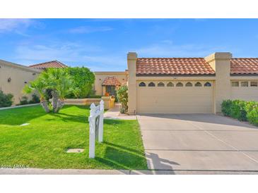Charming single-Gathering home with tile roof, well-maintained landscaping, and attached two-car garage at 5505 E Mclellan Rd # 41, Mesa, AZ 85205