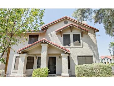 Charming two-story home featuring a red tile roof and well-maintained landscaping at 6262 E Brown Rd # 30, Mesa, AZ 85205