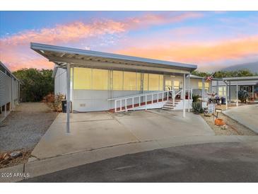 Charming home with covered parking, ramp access, and lovely desert landscaping in a friendly community at 6960 W Peoria Ave # 29B, Peoria, AZ 85345