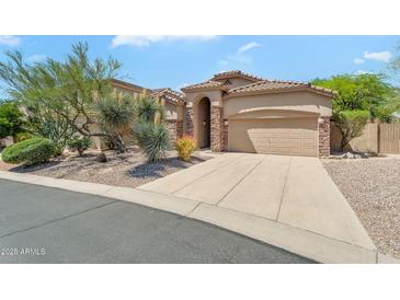 Stunning single-story home with desert landscaping, neutral stucco, and a tile roof at 7544 E Sierra Morena Cir, Mesa, AZ 85207