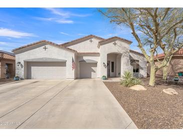 Charming single-story home featuring a stucco exterior, three-car garage and desert landscaping at 9626 W Bajada Rd, Peoria, AZ 85383