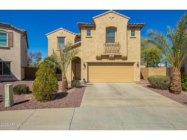 Charming two-story home featuring a tile roof, desert landscaping, and a two-car garage at 16238 N 22Nd Ln, Phoenix, AZ 85023
