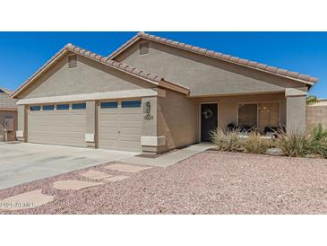Charming single-story home featuring a three-car garage and well-maintained desert landscaping at 6526 W West Wind Dr, Glendale, AZ 85310