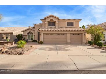 Charming two-story home with a three-car garage, desert landscaping and tile roof at 1333 E Rockledge Rd, Phoenix, AZ 85048