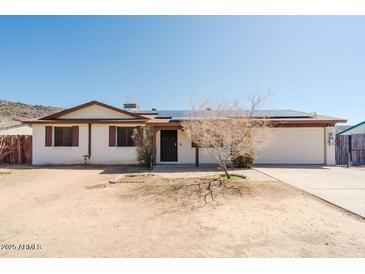 Charming single-story home featuring desert landscaping, a two-car garage, and a welcoming entrance at 13425 N 16Th Ave, Phoenix, AZ 85029