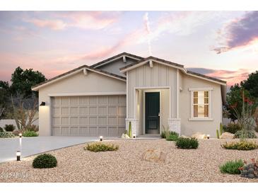 Charming single-story home featuring a neutral color palette and desert landscaping at 2475 E Music Mountain Ave, Apache Junction, AZ 85119