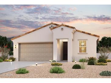 Inviting single-story home with warm-toned roof tiles, stucco walls and manicured desert landscaping at 2570 E Music Mountain Ave, Apache Junction, AZ 85119