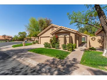 Inviting single-Gathering home with a well-kept lawn, desert landscaping, and a two-car garage at 32 E Dawn Dr, Tempe, AZ 85284