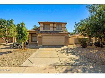 Charming two-story home with a neutral color palette, well-manicured landscaping and a two car garage at 3299 E Boston St, Gilbert, AZ 85295