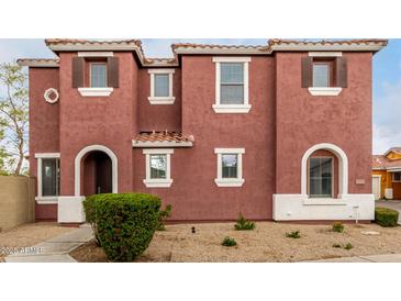 Charming two-story home with terracotta-colored stucco and well-maintained landscaping at 924 E Redondo Dr, Gilbert, AZ 85296