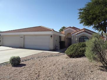 Charming home with a three-car garage and well-maintained desert landscaping at 14462 N Sherwood Dr # B, Fountain Hills, AZ 85268