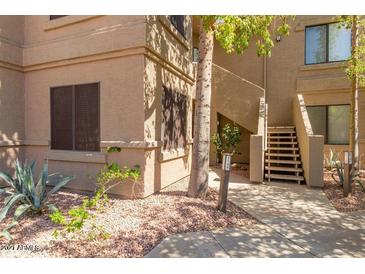 Inviting home exterior with well-manicured landscaping and direct access to stairway at 15252 N 100Th St # 1151, Scottsdale, AZ 85260