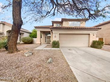 Charming two-story home with a well-maintained front yard and attached two-car garage at 1940 W Oriole Way, Chandler, AZ 85286