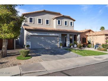 Charming two-story home featuring a spacious driveway and well-maintained landscaping at 366 E Mule Train Trl, San Tan Valley, AZ 85143