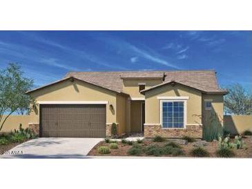 Charming single-story home features a two-car garage and desert landscaping at 5508 N 192Nd Ave, Litchfield Park, AZ 85340